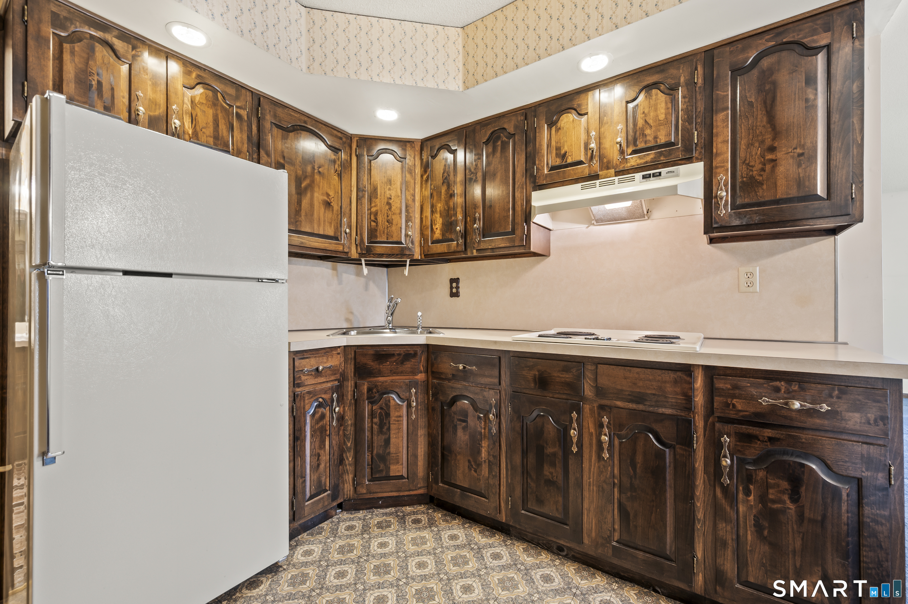 117 Charter Oak Road Southbury, CT 06488 - Photo 35 of 40 a kitchen with stainless steel appliances granite countertop a refrigerator a sink and a stove
