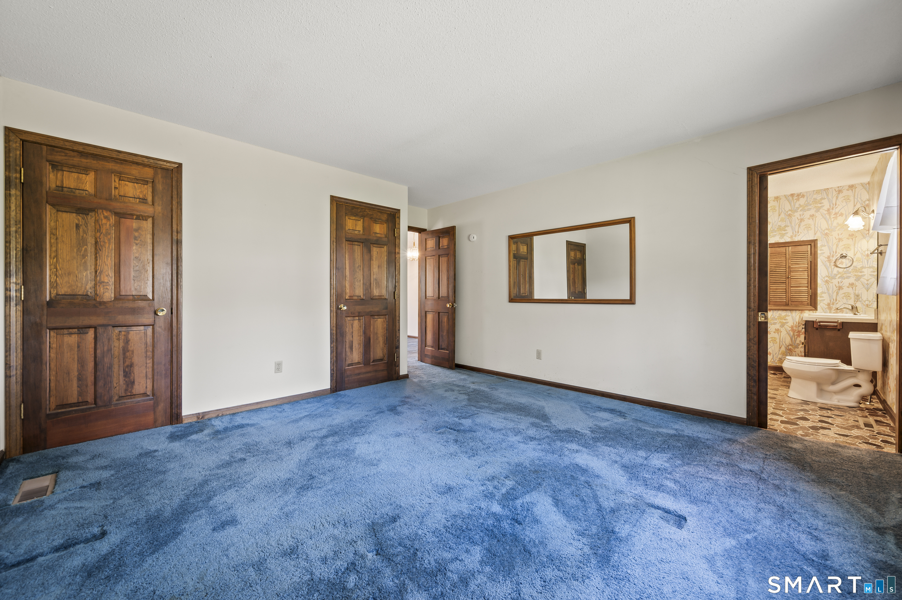 117 Charter Oak Road Southbury, CT 06488 - Photo 39 of 40 an empty room with chandelier fan and windows