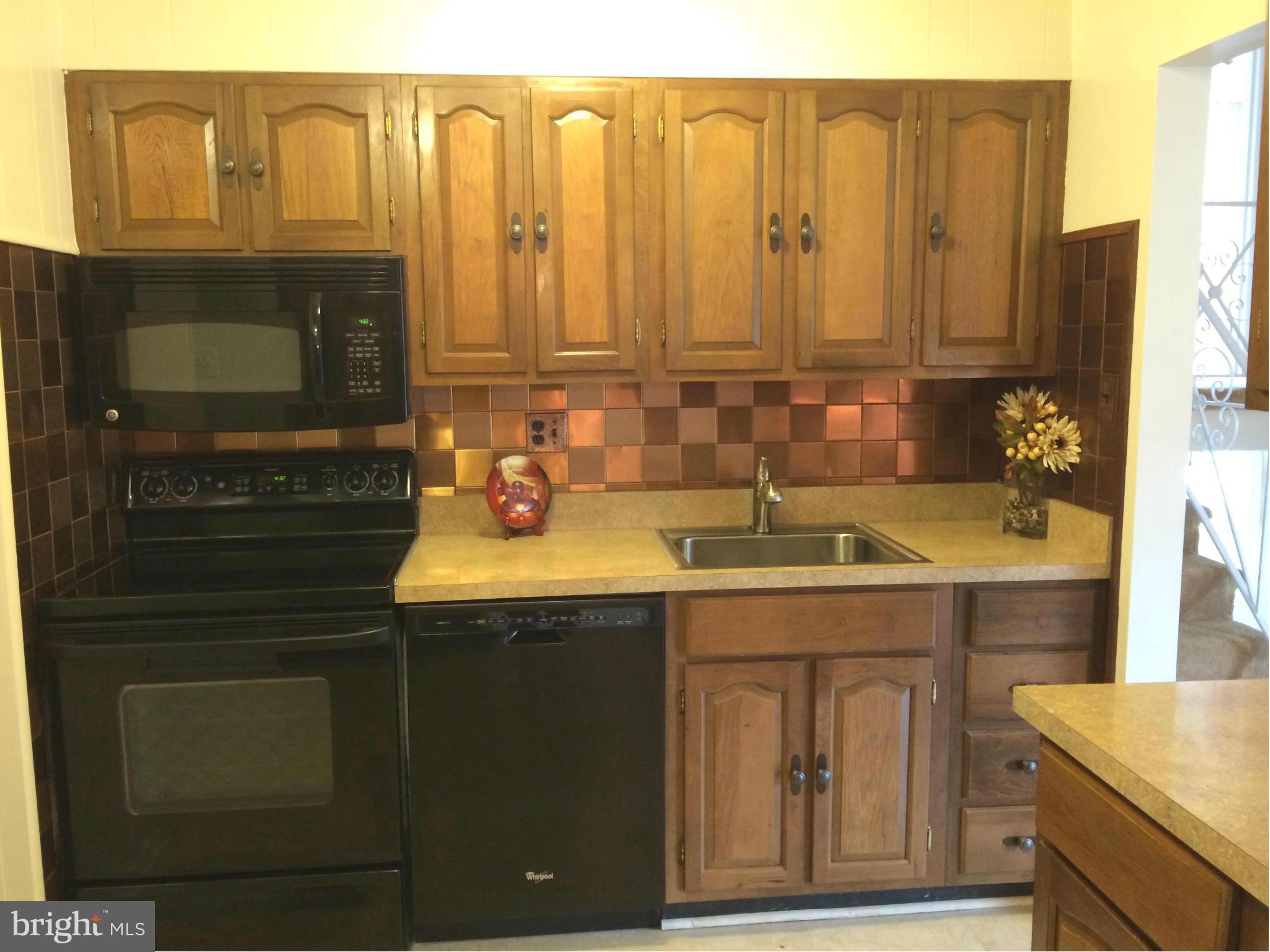 3530 Olympic Street Silver Spring, MD 20906 - Photo 6 of 27 KITCHEN HAS DECORATIVE BACKSPLASH