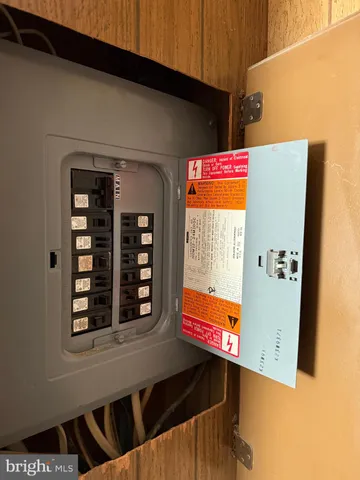 a living room with furniture and a closet