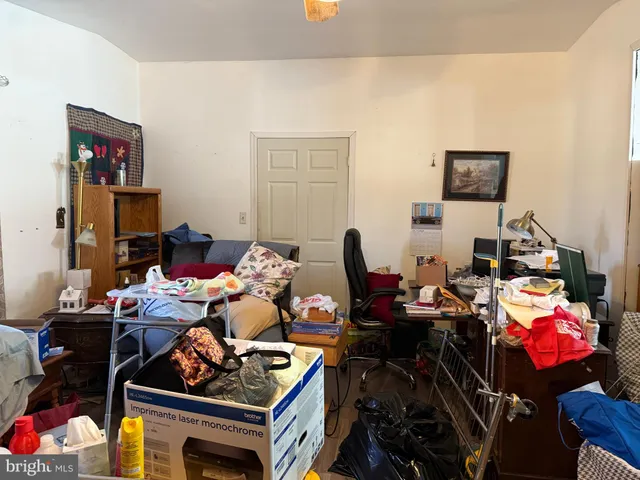 a room with furniture a rug and a window