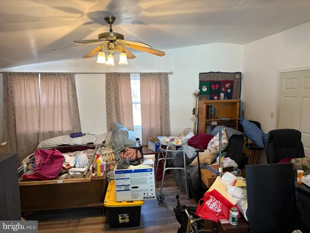 a bedroom with furniture and a window