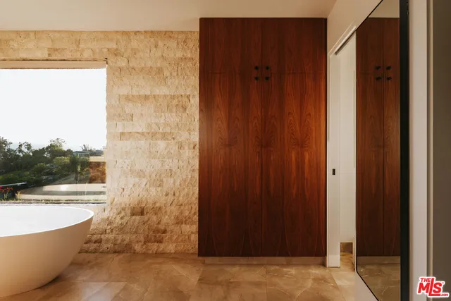 a bathroom with a bathtub and shower