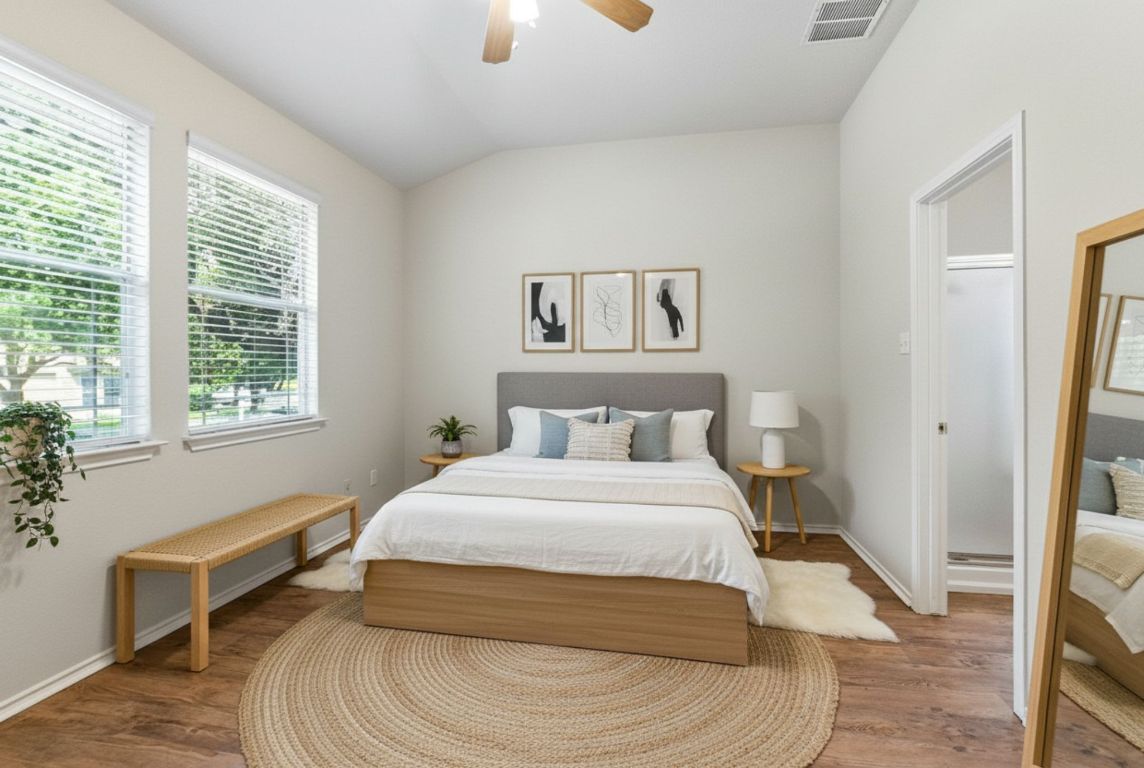 1114 Peyton Place Cedar Park, TX 78613 - Photo 14 of 39 a bedroom with a bed and a window