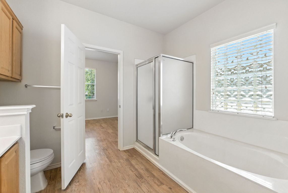 1114 Peyton Place Cedar Park, TX 78613 - Photo 18 of 39 a bathroom with a bathtub toilet and sink