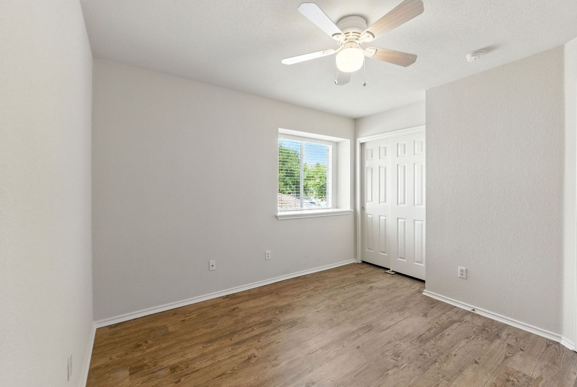 1114 Peyton Place Cedar Park, TX 78613 - Photo 23 of 39 an empty room with windows and ceiling fan
