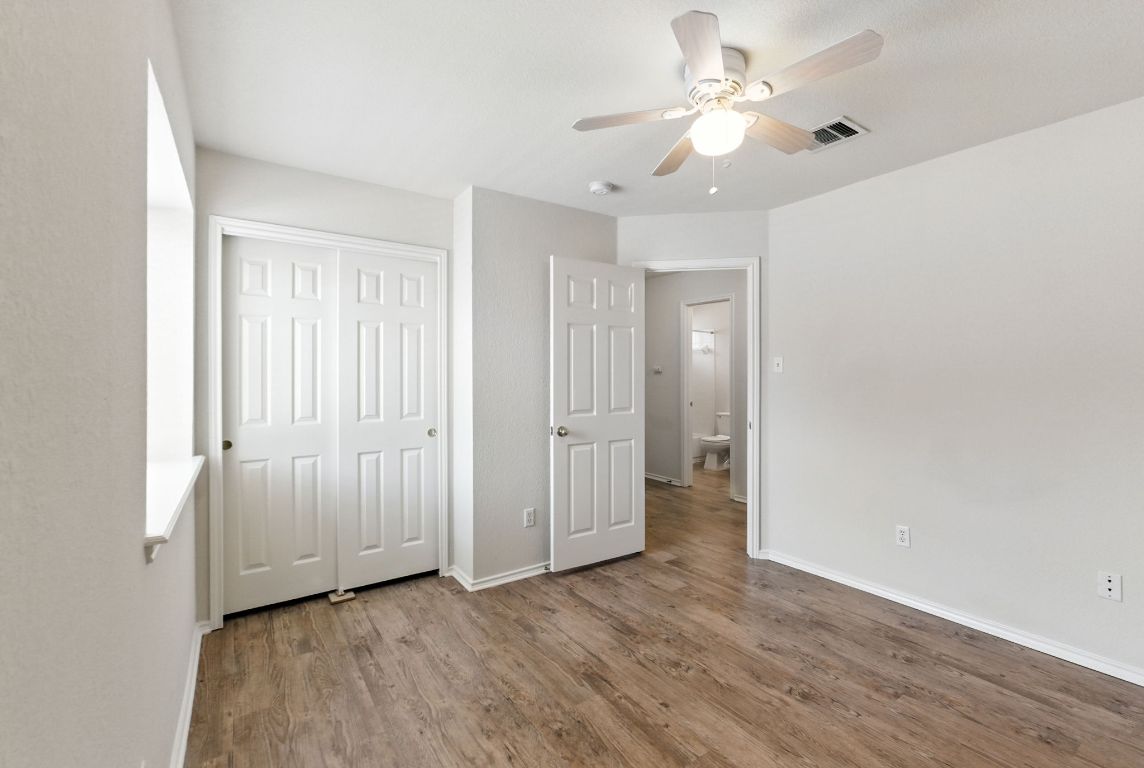 1114 Peyton Place Cedar Park, TX 78613 - Photo 24 of 39 an empty room with a bathroom and a ceiling fan