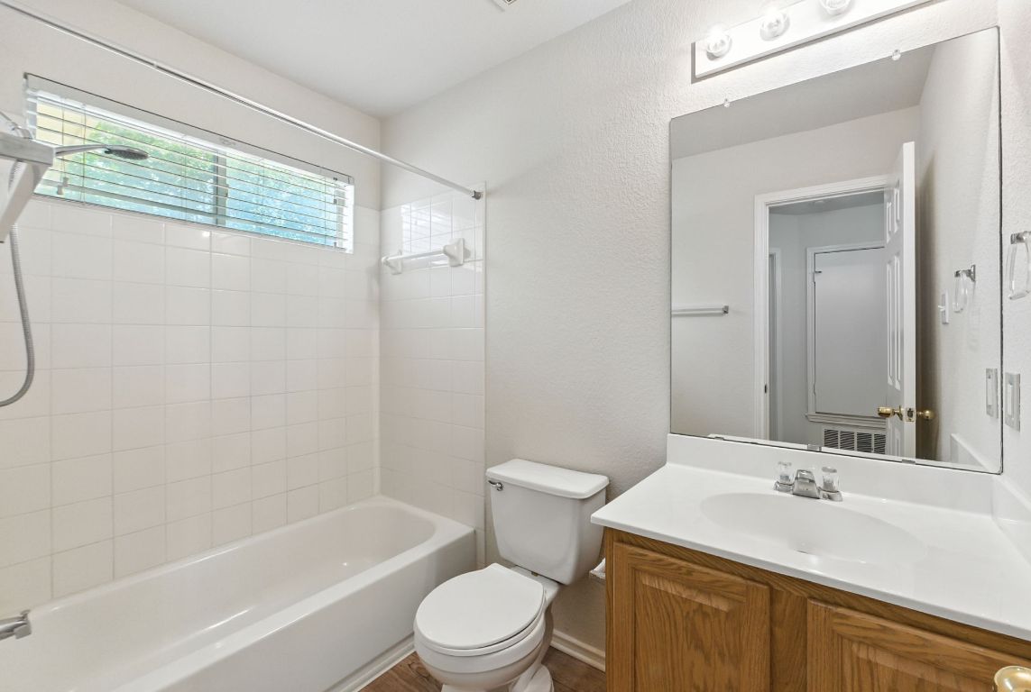1114 Peyton Place Cedar Park, TX 78613 - Photo 25 of 39 a bathroom with a sink a toilet and shower