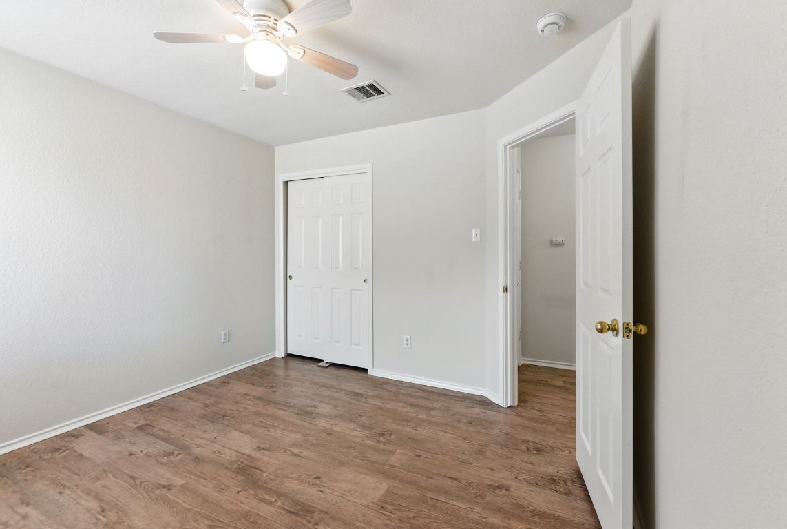 1114 Peyton Place Cedar Park, TX 78613 - Photo 27 of 39 wooden floor in an empty room