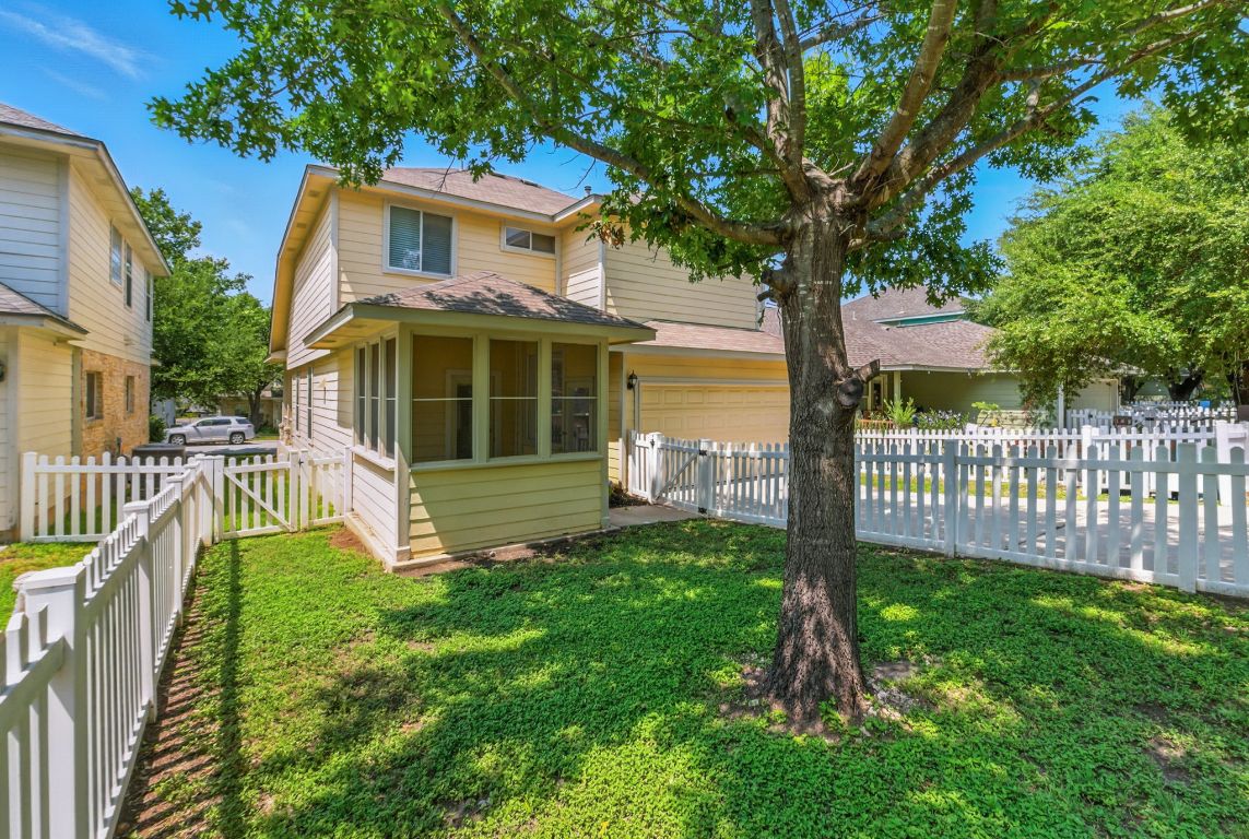1114 Peyton Place Cedar Park, TX 78613 - Photo 31 of 39 a view of a house with a yard and a large tree