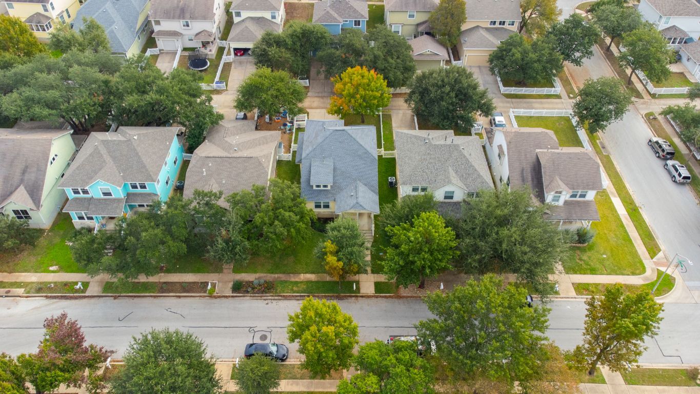 1114 Peyton Place Cedar Park, TX 78613 - Photo 35 of 39 an aerial view of residential houses with yard and swimming pool