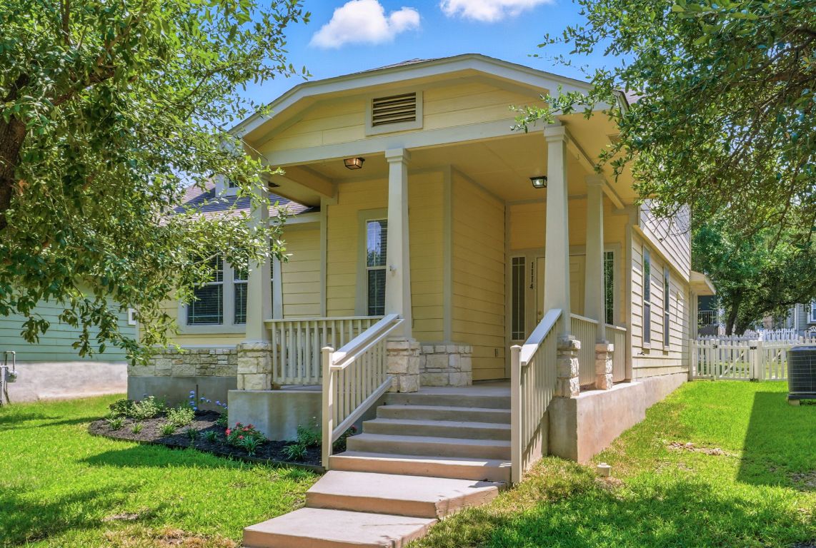 1114 Peyton Place Cedar Park, TX 78613 - Photo 4 of 39 a front view of a house with garden