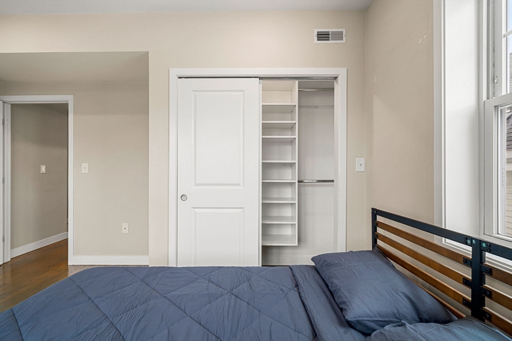 47 Sargent Street, Unit 3 Boston, MA 02125 - Photo 24 of 42 an empty room with closet and cabinet