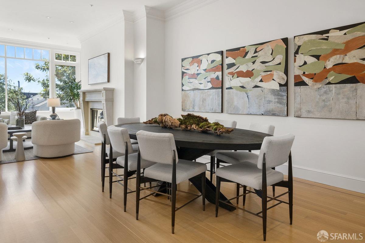 2961 Pacific Avenue San Francisco, CA 94115 - Photo 13 of 64 a view of a dining room with furniture wooden floor and a painting
