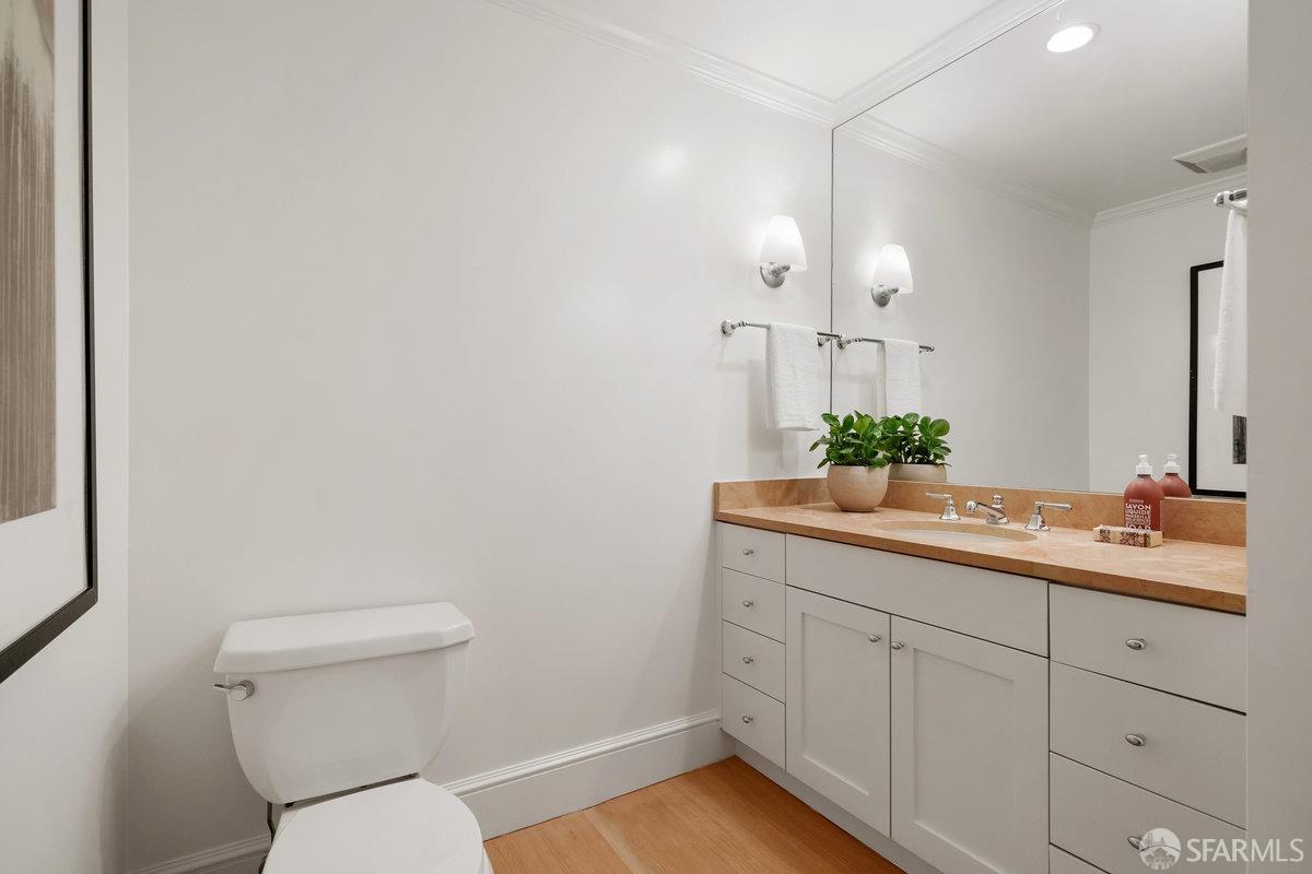 2961 Pacific Avenue San Francisco, CA 94115 - Photo 20 of 64 a bathroom with a toilet sink and mirror