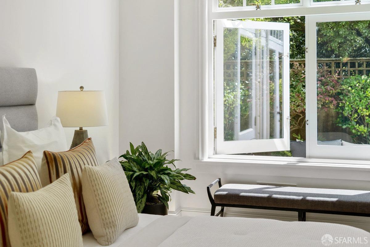 2961 Pacific Avenue San Francisco, CA 94115 - Photo 46 of 64 a view of a balcony with chair and potted plants