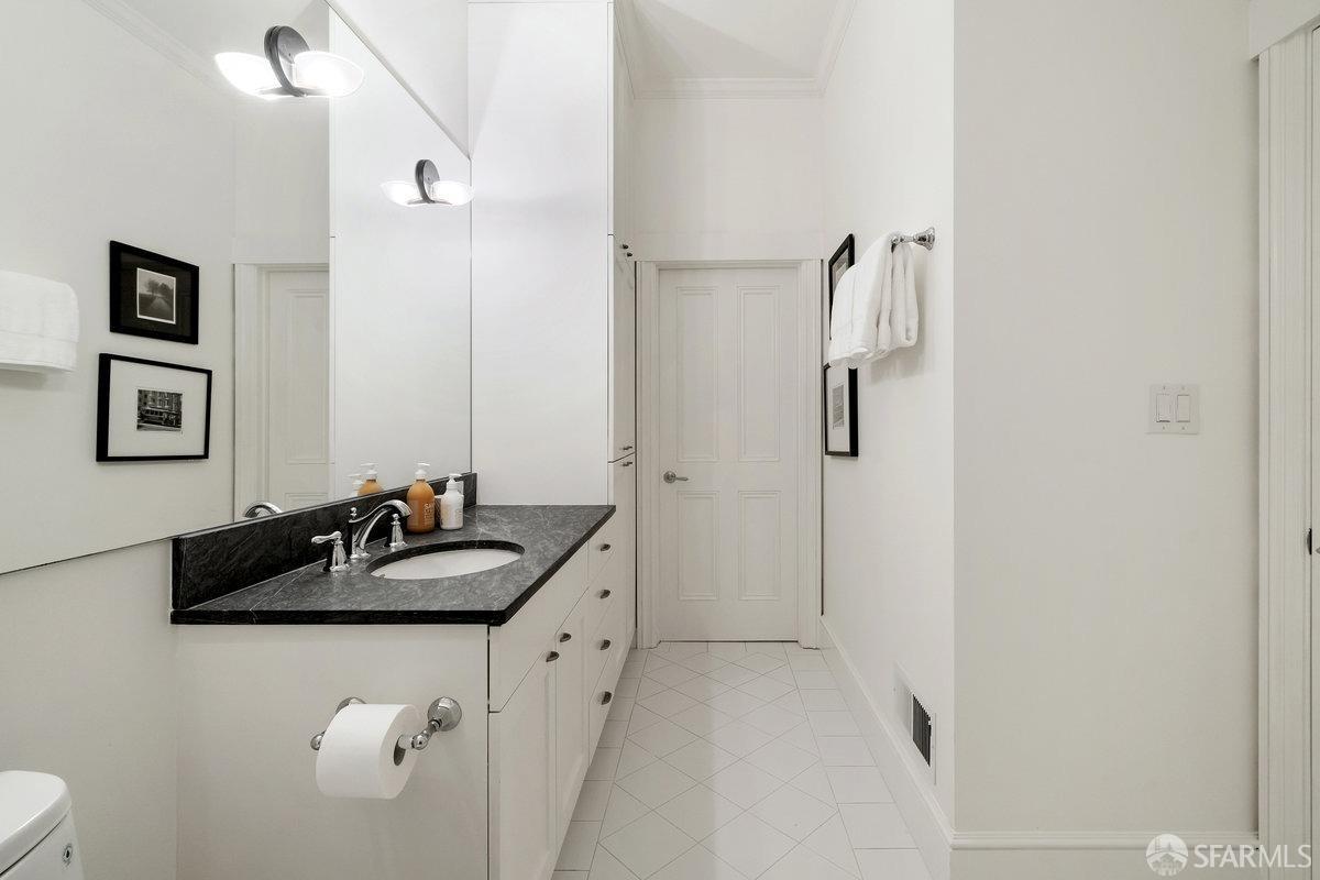 2961 Pacific Avenue San Francisco, CA 94115 - Photo 48 of 64 a bathroom with a sink and a mirror