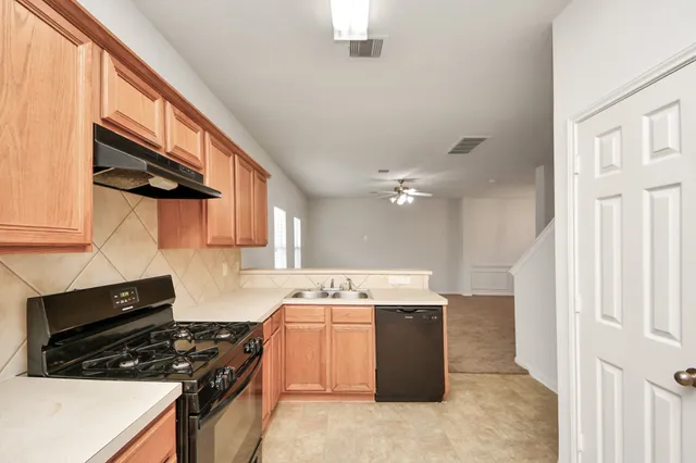 a kitchen with a stove and a microwave