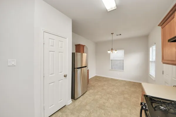 a view of a kitchen with a sink cabinets and a window