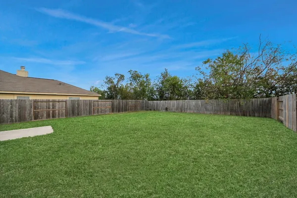 a backyard of a house with lots of green space