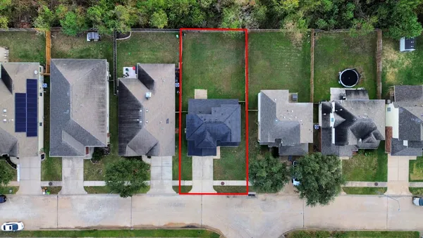 an aerial view of a house with a garden and plants