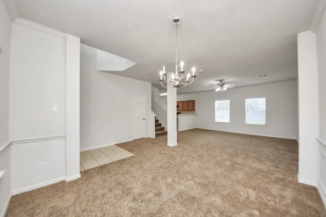 a view of a chandelier in big room and chandelier