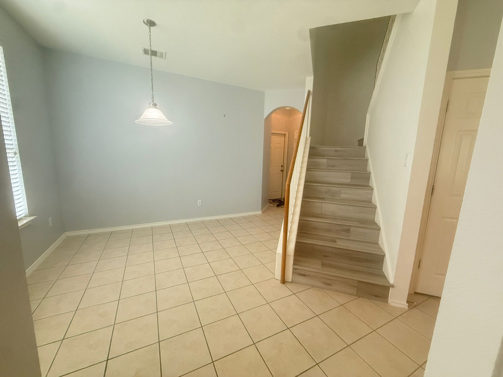 1900 Scofield Ridge Parkway, Unit 2103 Austin, TX 78727 - Photo 5 of 35 Dinning room, leading to powder room and garage on the back