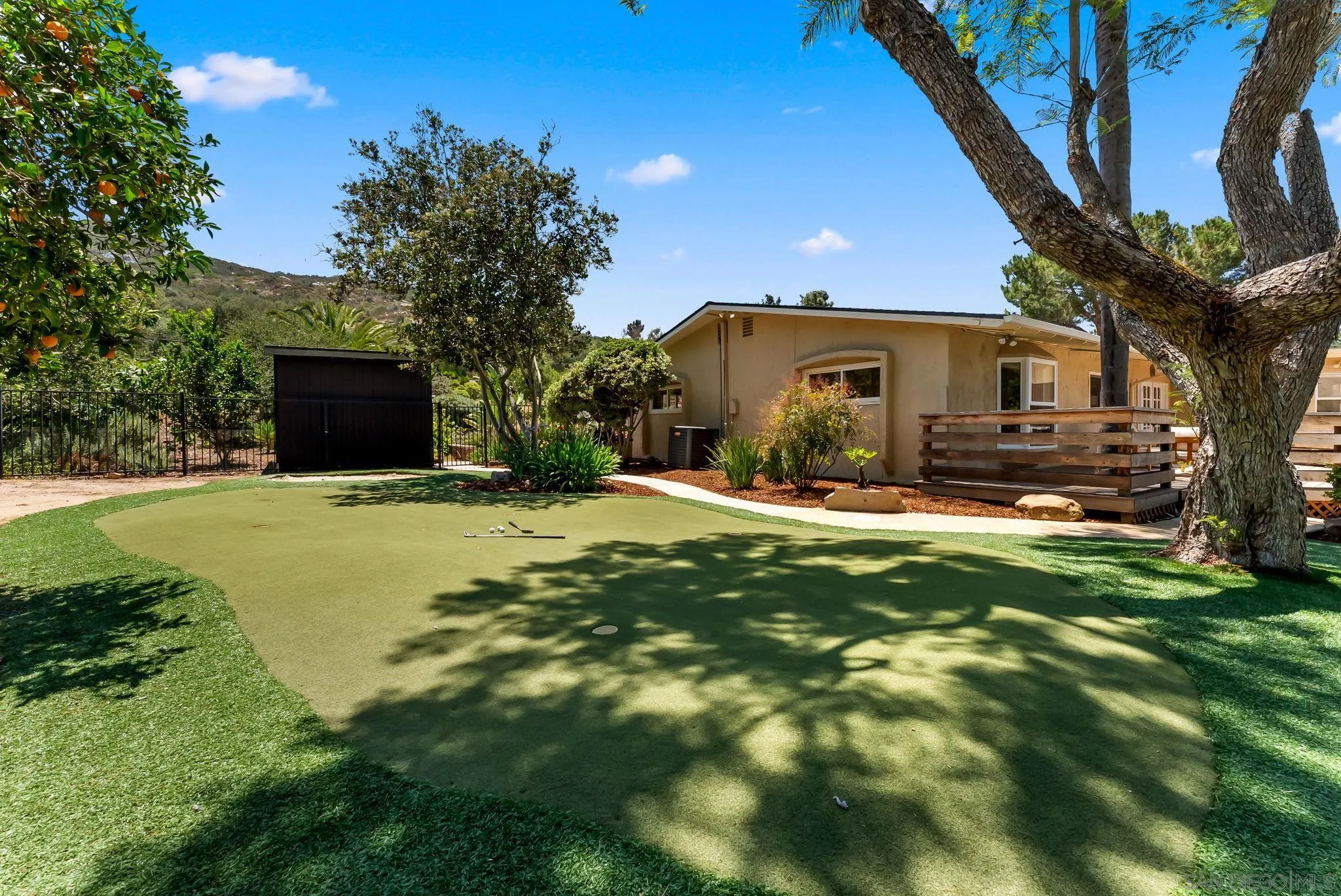 12832 Stone Canyon Road Poway, CA 92064 - Photo 50 of 60 a view of a house with a yard