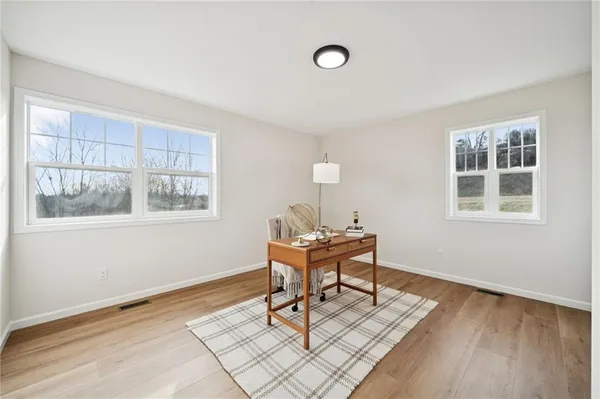 a work room with furniture and windows