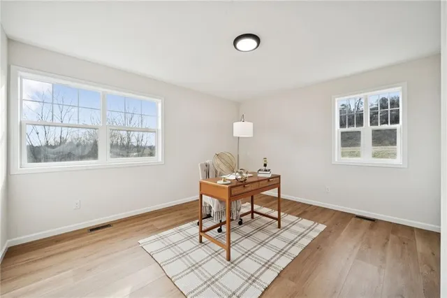 a work room with furniture and windows