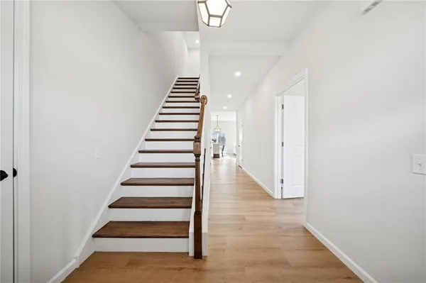 a view of entryway with wooden floor
