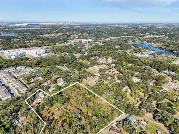 an aerial view of residential building with parking