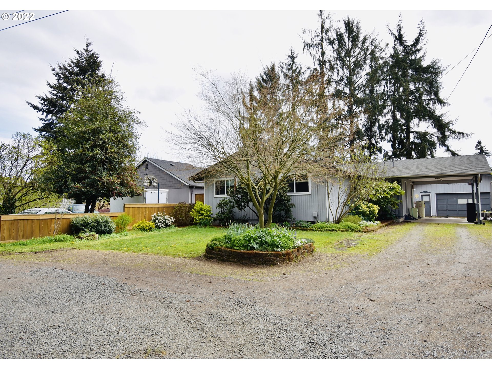 717 Night Hawk Lane Springfield, OR 97477 - Photo 19 of 32 a front view of a house with a yard and garage