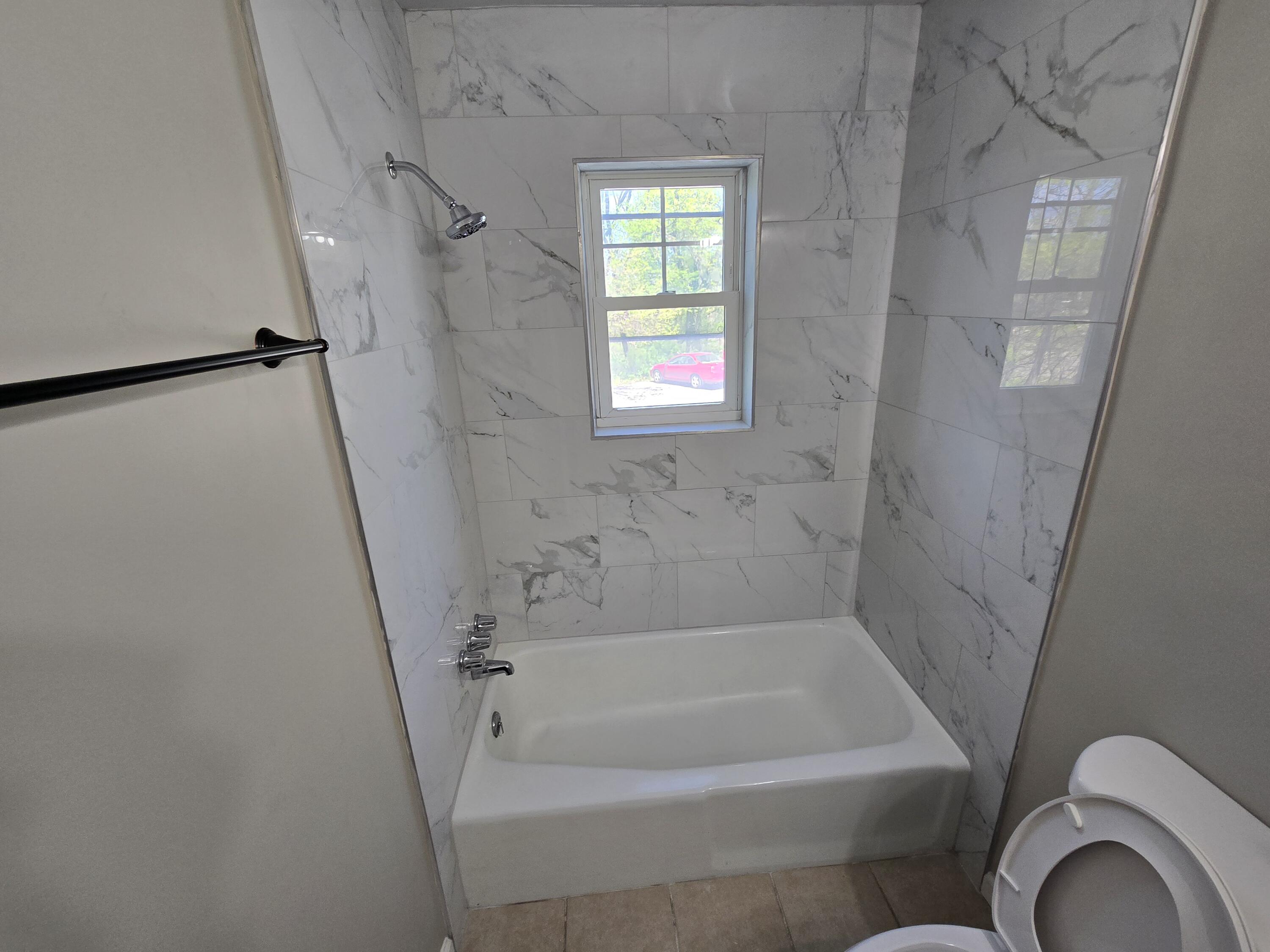 2657 Westover Avenue Southwest, Unit 9 Roanoke, VA 24015 - Photo 7 of 8 a bathroom with a bathtub and shower