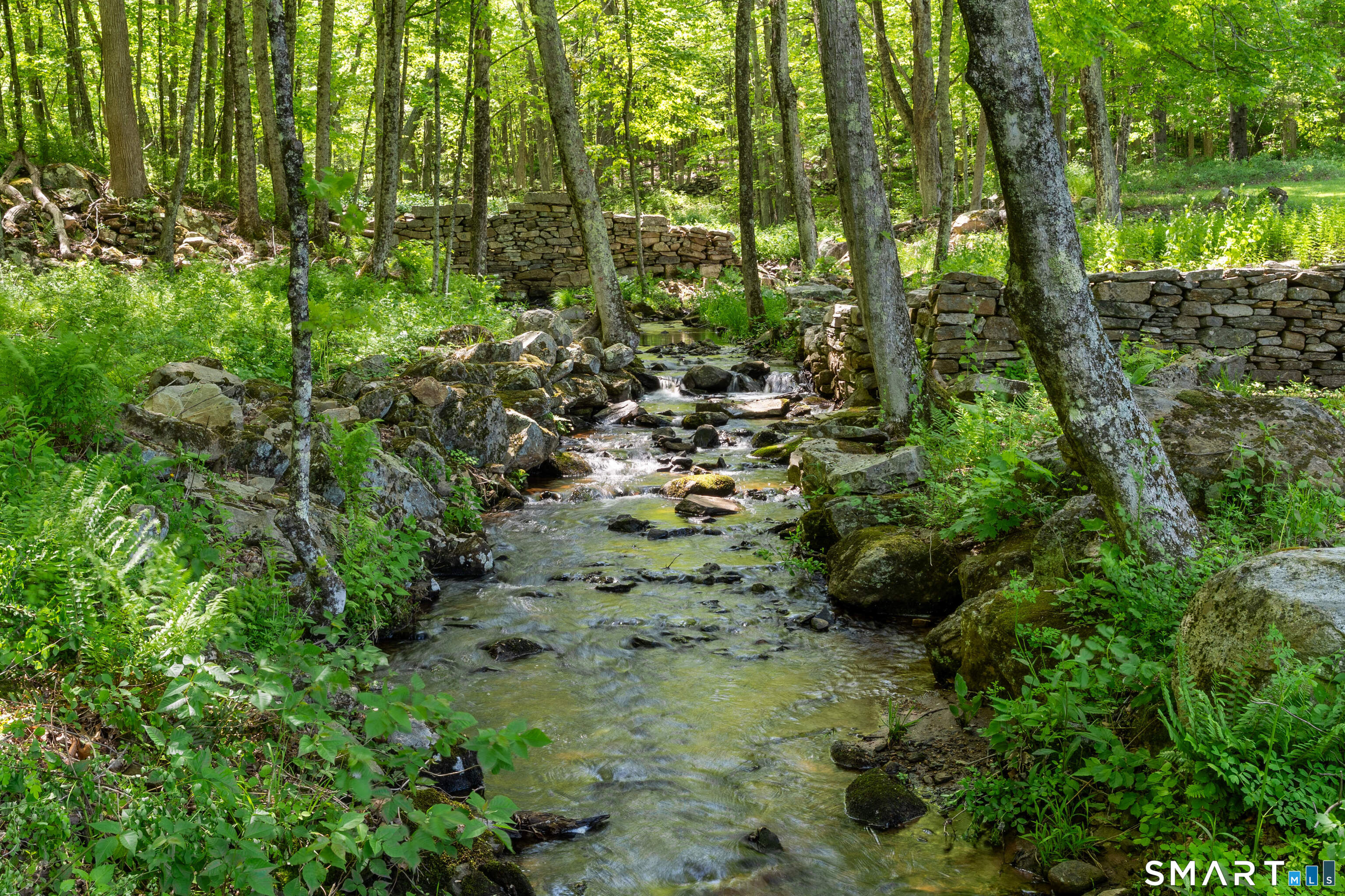 93 Upton Road Ashford, CT 06278 - Photo 39 of 40 The land is pure magic w/well-maintained trails, open meadows, rolling clearings, antique stone walls, untouched mature forest, natural waterfalls, gently babbling Knowlton & Moritz Brooks & direct access to Nipmuck Trail.