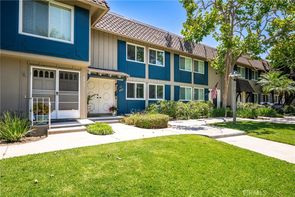 4237 Larwin Avenue Cypress, CA 90630 - Photo 5 of 48 a front view of a house with a yard and porch