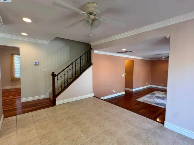 a kitchen with stainless steel appliances a sink a stove a microwave a center island and cabinets