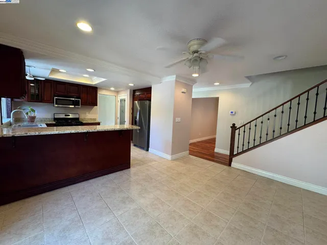 a bed sitting in a room next to a window