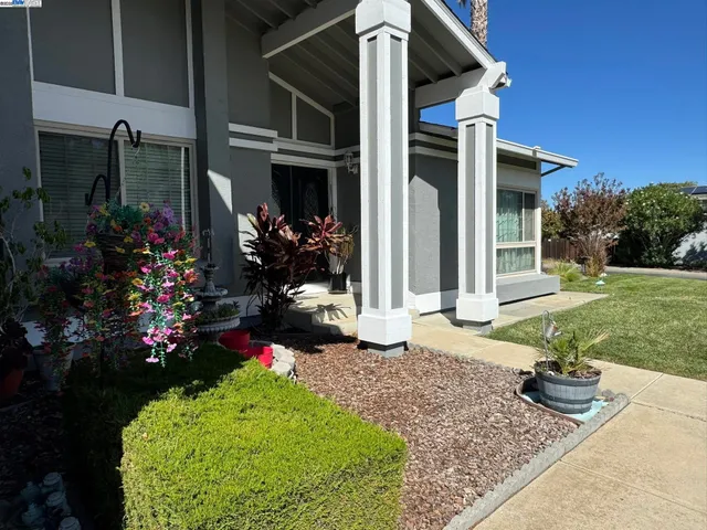a view of staircase with white walls and window