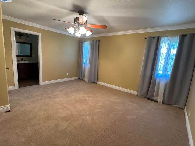 a bathroom with a sink a toilet a mirror and shower