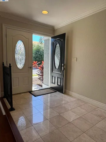 a view of a bedroom with wooden floor