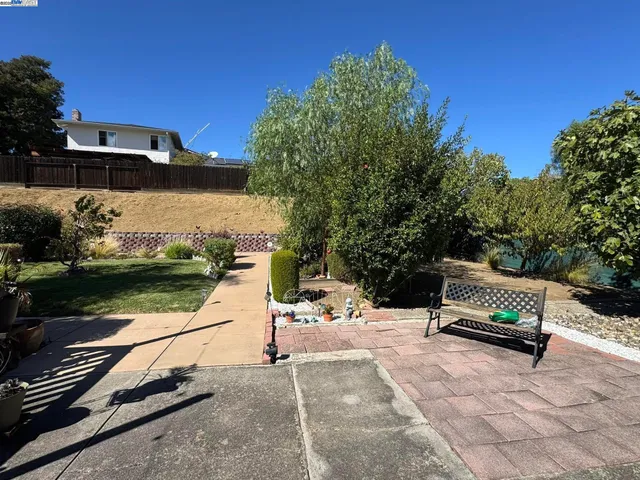 a view of a backyard with chairs