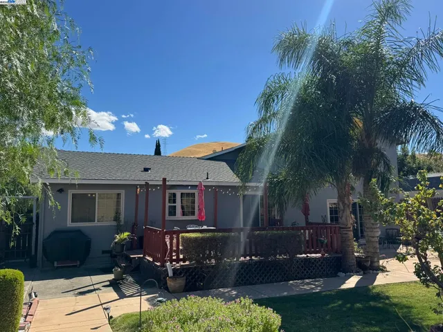 a vase of flowers sitting on a floor