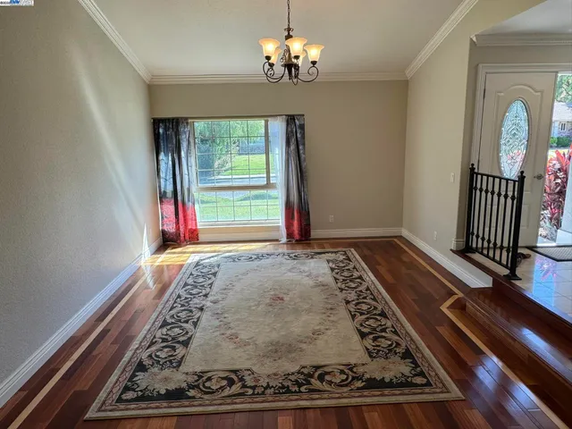 a view of living room with granite countertop furniture and floor to ceiling window