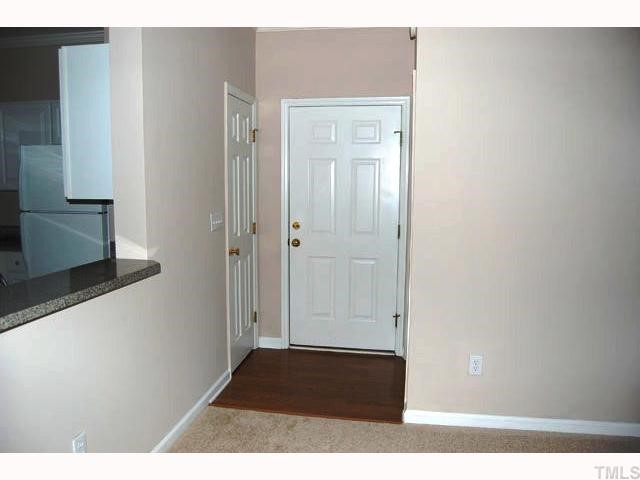 The foyer greets you with warm hardwood floors and crown molding.