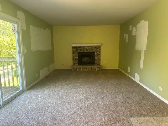 an empty room with a fireplace