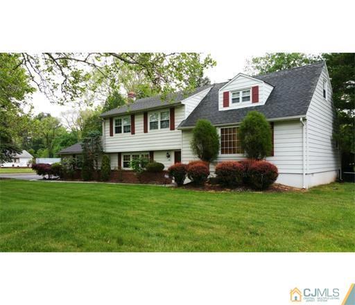 434 Plainfield Road Edison, NJ 08820 - Photo 1 of 16 a front view of a house with a garden