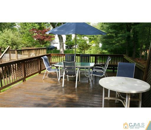 434 Plainfield Road Edison, NJ 08820 - Photo 16 of 16 a balcony with table and chairs