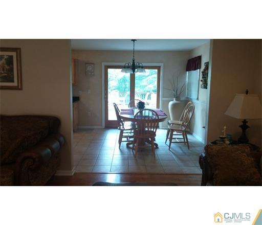 434 Plainfield Road Edison, NJ 08820 - Photo 6 of 16 a living room with furniture and a large window