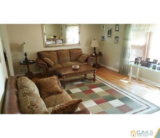 434 Plainfield Road Edison, NJ 08820 - Photo 8 of 16 a living room with furniture and a rug
